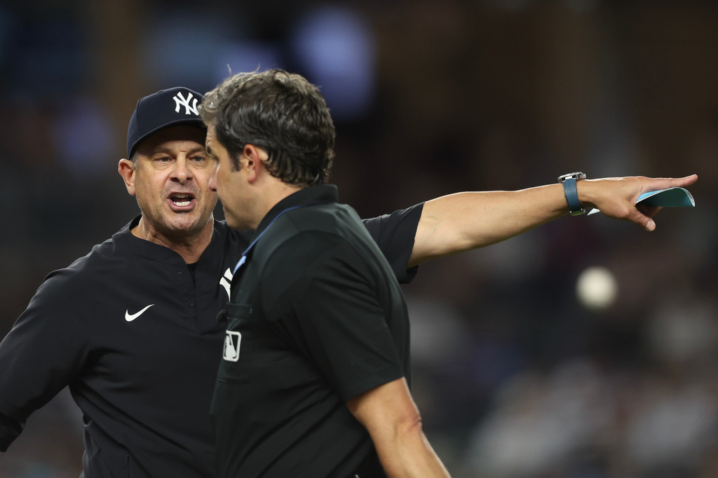 New York Yankees manager Aaron Boone, left, yells at the umpire and is ejected at the top of the eighth inning of a baseball game against the Toronto Blue Jays, Tuesday, May 19, 2026, in New York. (AP Photo/Heather Khalifa)