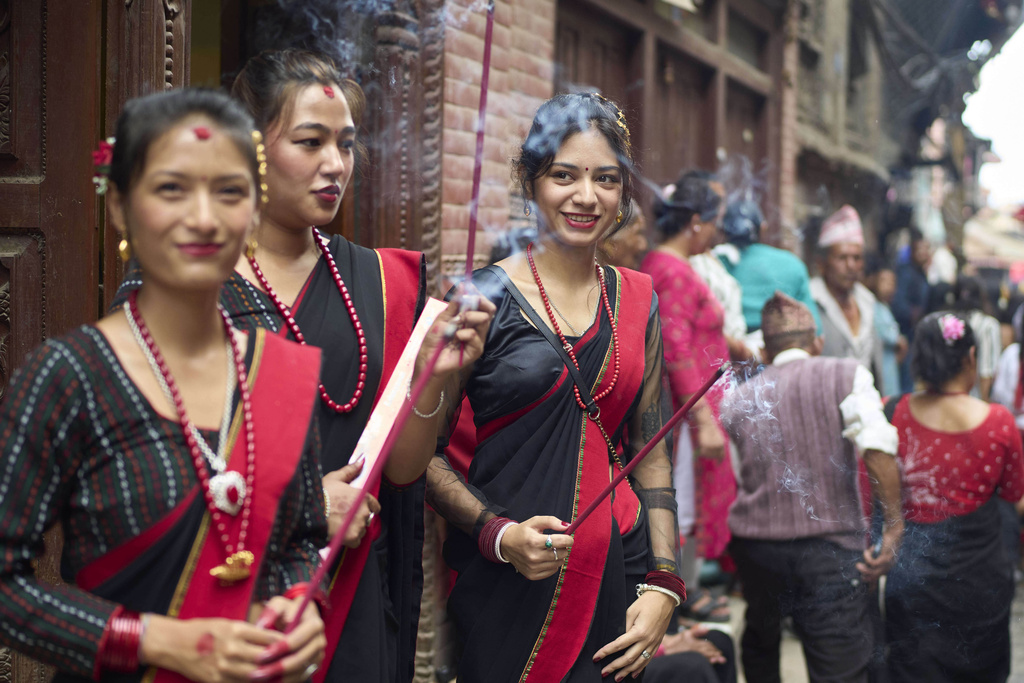 Devotees light incense during a parade celebrating the birthday of Lord Krishna on Krishna Janmashtami in Bhaktapur,Nepal, Saturday, Aug. 16, 2025. (AP Photo/Niranjan Shrestha)