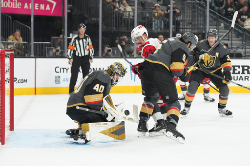 Vegas Golden Knights goaltender Akira Schmid (40) stops a shot by the Carolina Hurricanes during the first period of an NHL hockey game Monday, Oct. 20, 2025, in Las Vegas. (AP Photo/Candice Ward) Vegas Golden Knights goaltender Akira Schmid (40) stops a shot by the Carolina Hurricanes during the first period of an NHL hockey game Monday, Oct. 20, 2025, in Las Vegas. (AP Photo/Candice Ward)