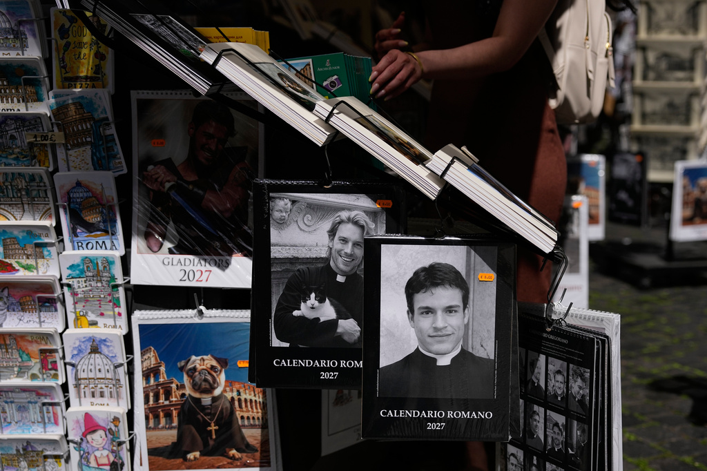 The 'Calendario Romano' calendar, bearing a photo of Giovanni Galizia, who is not a priest, is on sale in a souvenir shop in Rome, Wednesday, May 20, 2026. (AP Photo/Alessandra Tarantino)