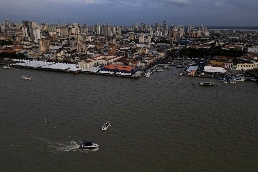 A boat moves through Guajara Bay ahead of the COP30 U.N. Climate Summit, in Belem, Brazil, Friday, Oct. 31, 2025. (AP Photo/Eraldo Peres)