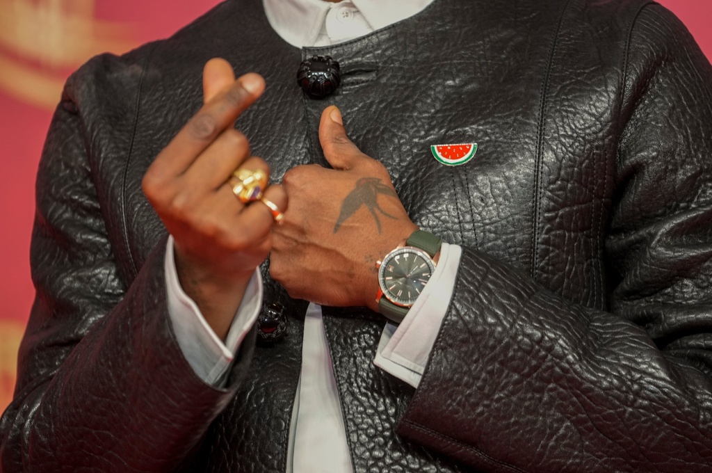 British filmmaker Akinola Davies Jr. gestures while wearing a pro-Palestinian pin during the 22nd Marrakech Film Festival, in Morocco, Wednesday, Dec. 3, 2025. (AP Photo/Mosa'ab Elshamy)