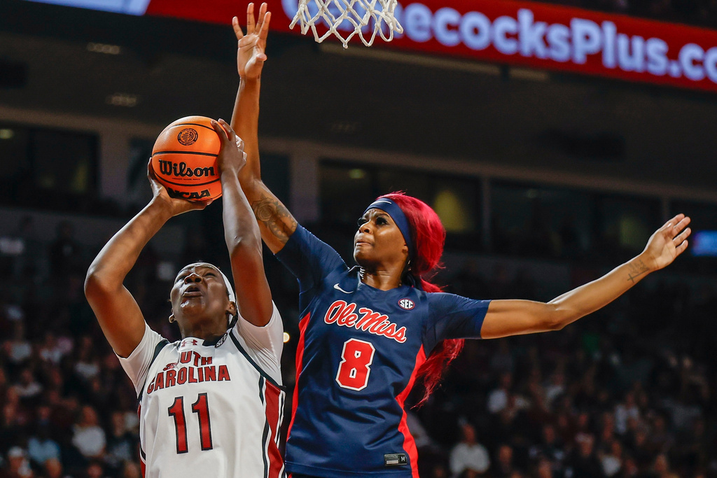 South Carolina center Madina Okot (11) looks to shoot against Mississippi forward Latasha Lattimore during the first half of an NCAA college basketball game in Columbia, S.C., Sunday, Feb. 22, 2026. (AP Photo/Nell Redmond)
