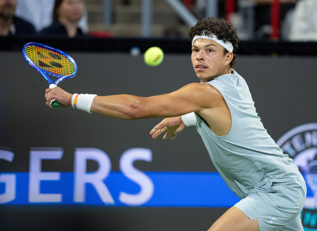 Ben Shelton of the United States hits a return to his compatriot Brandon Nakashima during the final tennis match of the National Bank Open in Montreal, Thursday, Aug. 13, 2026. (Christinne Muschi/The Canadian Press via AP)