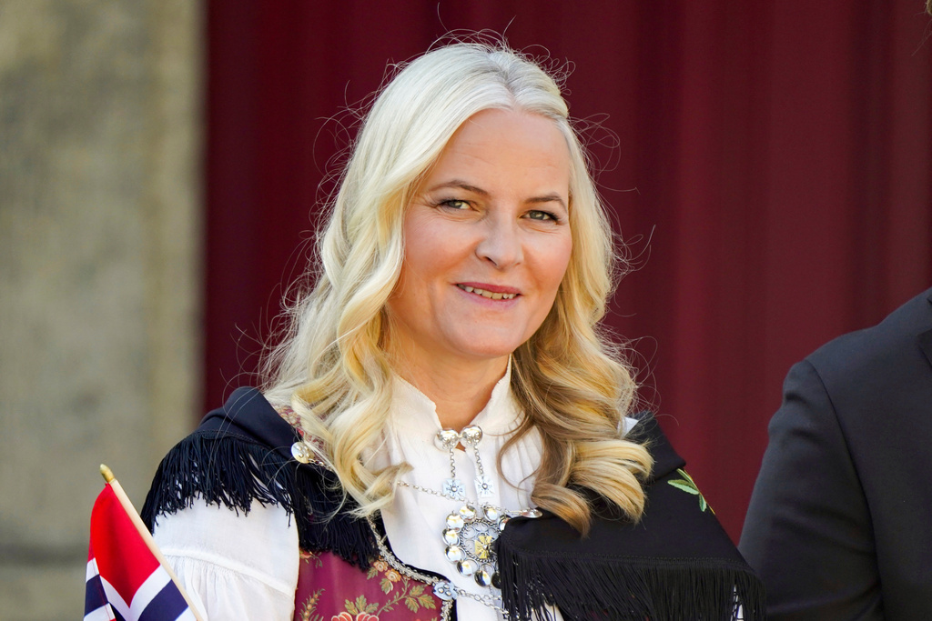 FILE - Norway's Crown Princess Mette-Marit watches a parade on the occasion of Norway's Constitution Day, at Skaugum, their official residence, near Oslo, Wednesday, May 17, 2023. (Lise Aserud/NTB Scanpix via AP, File)