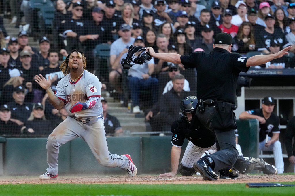 Cleveland Guardians' Jos&eacute; Ram&iacute;rez, left, celebrates after scoring on a fielder's choice by Chase DeLauter during the fifth inning in Game 3 of baseball's American League Division Series against the Chicago White Sox Wednesday, Oct. 7, 2026, in Chicago. (AP Photo/Nam Y. Huh)