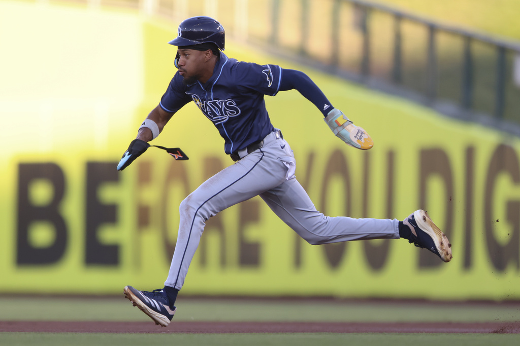 Tampa Bay Rays' Chandler Simpson sprints to second base after a fielding error by Athletics first baseman Tyler Soderstrom during the first inning of a baseball game, Wednesday, Aug. 13, 2025, in West Sacramento, Calif. (AP Photo/Scott Marshall)
