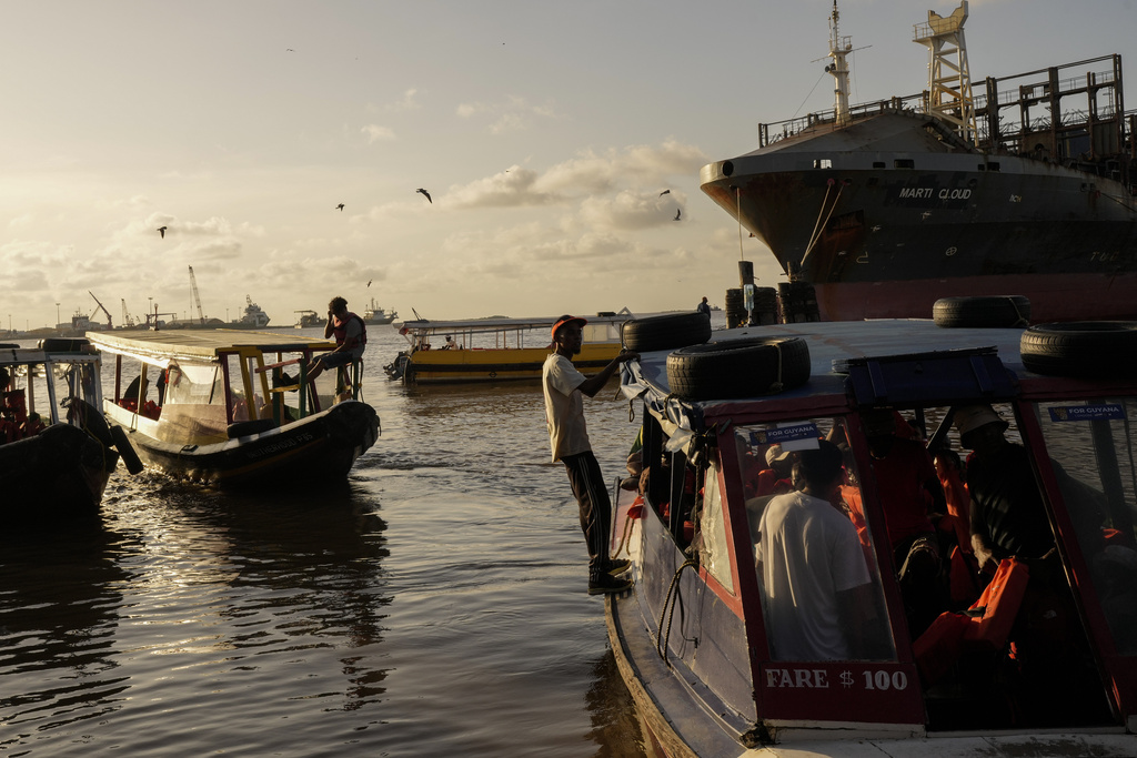 Boats dock at Stabroek Market in Georgetown, Guyana, Sunday, Aug. 31, 2025, a day ahead of the general elections. (AP Photo/Matias Delacroix)