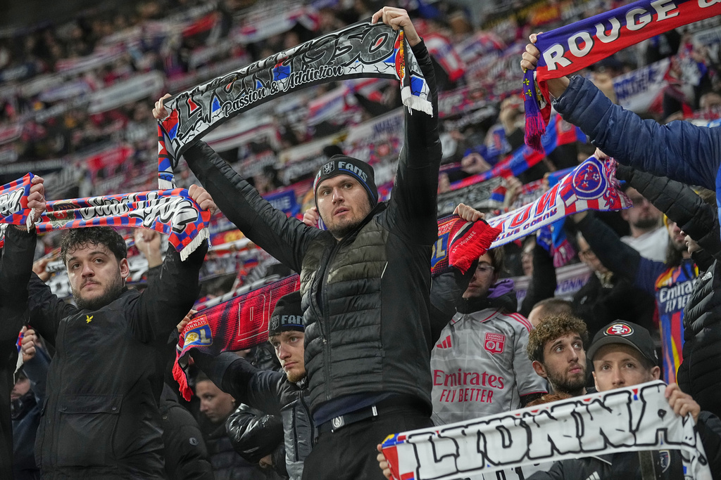 Lyon fans cheer their team ahead of the Europa League soccer match between Lyon and PAOK in Lyon, France, Thursday, Jan. 29, 2026. (AP Photo/Laurent Cipriani)