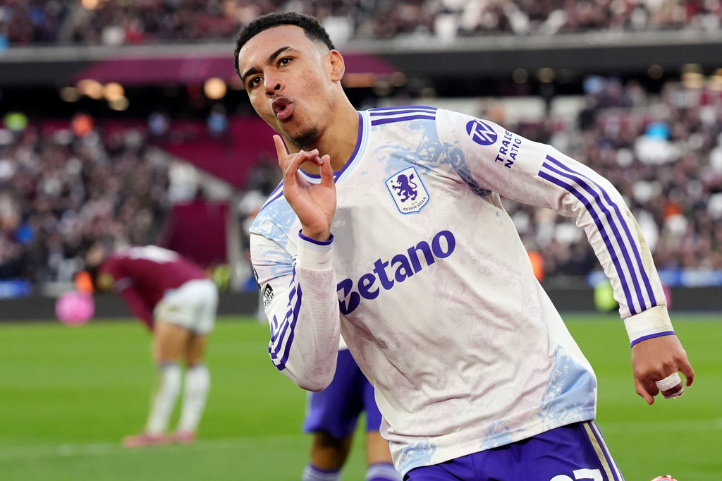Aston Villa's Morgan Rogers celebrates after scoring his side's second goal during the English Premier League soccer match between West Ham United and Aston Villa in London, England, Sunday, Dec. 14, 2025. (Jonathan Brady/PA via AP)