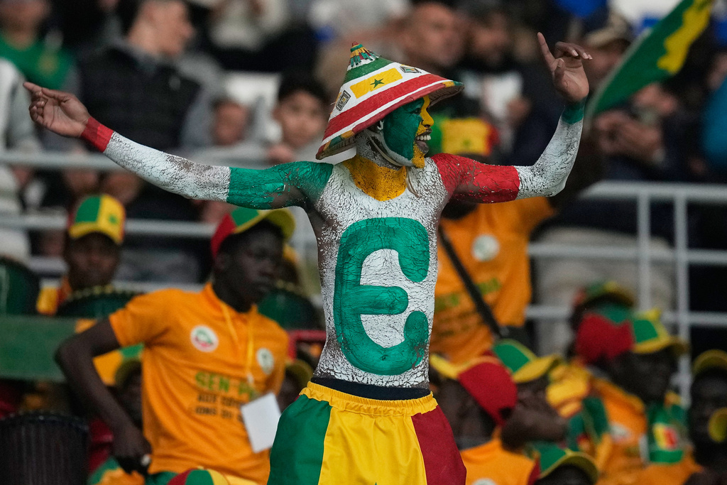 A senegalese fan cheers during the Africa Cup of Nations group D soccer match between Benin and Senegal in Tangier, Morocco, Tuesday, Dec. 30, 2025. (AP Photo/Themba Hadebe)
