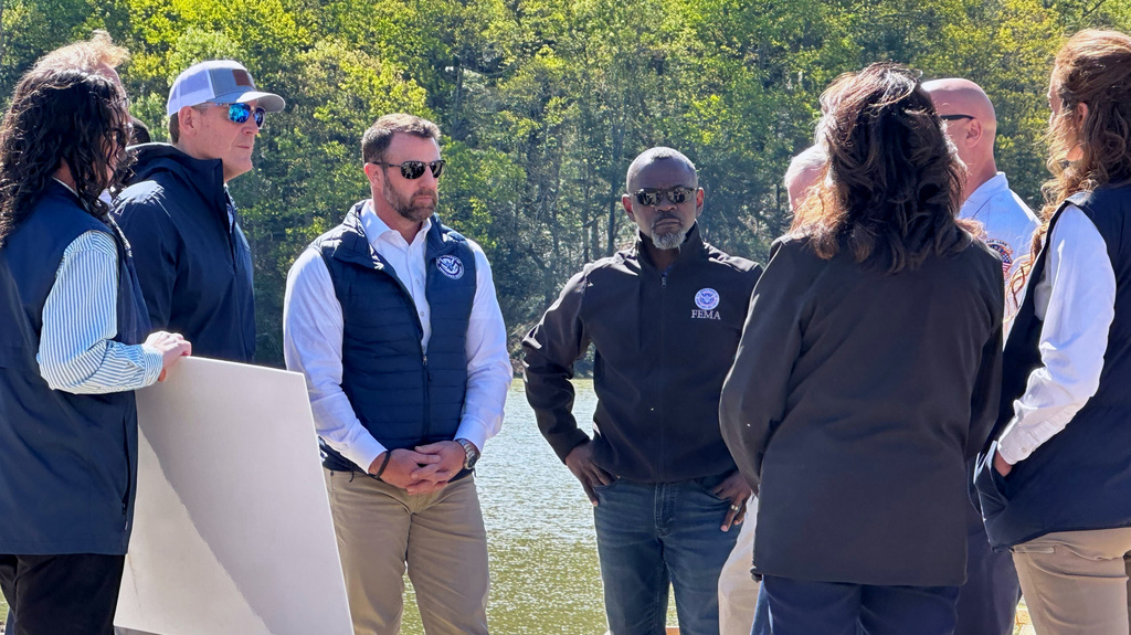 Homeland Security Secretary Markwayne Mullin, center left, listens to a briefing on hurricane recovery efforts, Tuesday, April 7, 2026 in Lake Lure, N.C. This is his first official trip since replacing Kristi Noem. (AP Photo Rebecca Santana)