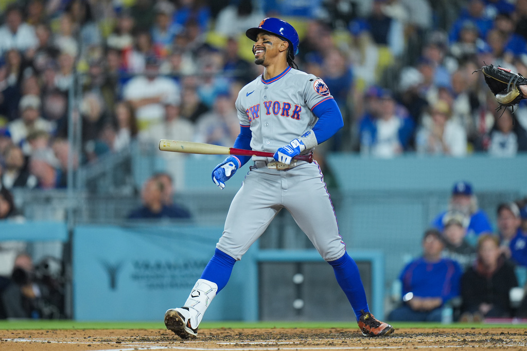 New York Mets' Francisco Lindor reacts after striking out during the third inning of a baseball game against the Los Angeles Dodgers Wednesday, April 15, 2026, in Los Angeles. (AP Photo/Jae C. Hong)