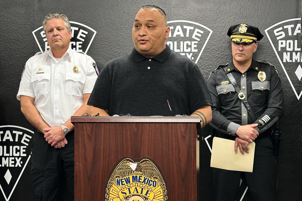Mountainair Mayor Peter Nieto, center, provides updates during a news conference in Albuquerque, New Mexico, on Friday, May 22, 2026 about an investigation into the deaths of three people in Torrance County and a potential fentanyl exposure for first responders who answered the call. The investigation is ongoing. (AP Photo/Susan Montoya Bryan)