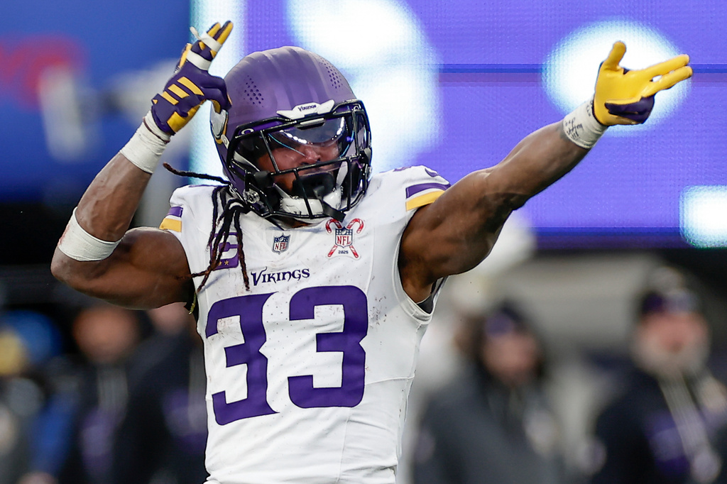 Minnesota Vikings running back Aaron Jones (33) reacts during the fourth quarter of an NFL football game against the New York Giants, Sunday, Dec. 21, 2025, in East Rutherford, N.J. (AP Photo/Adam Hunger)