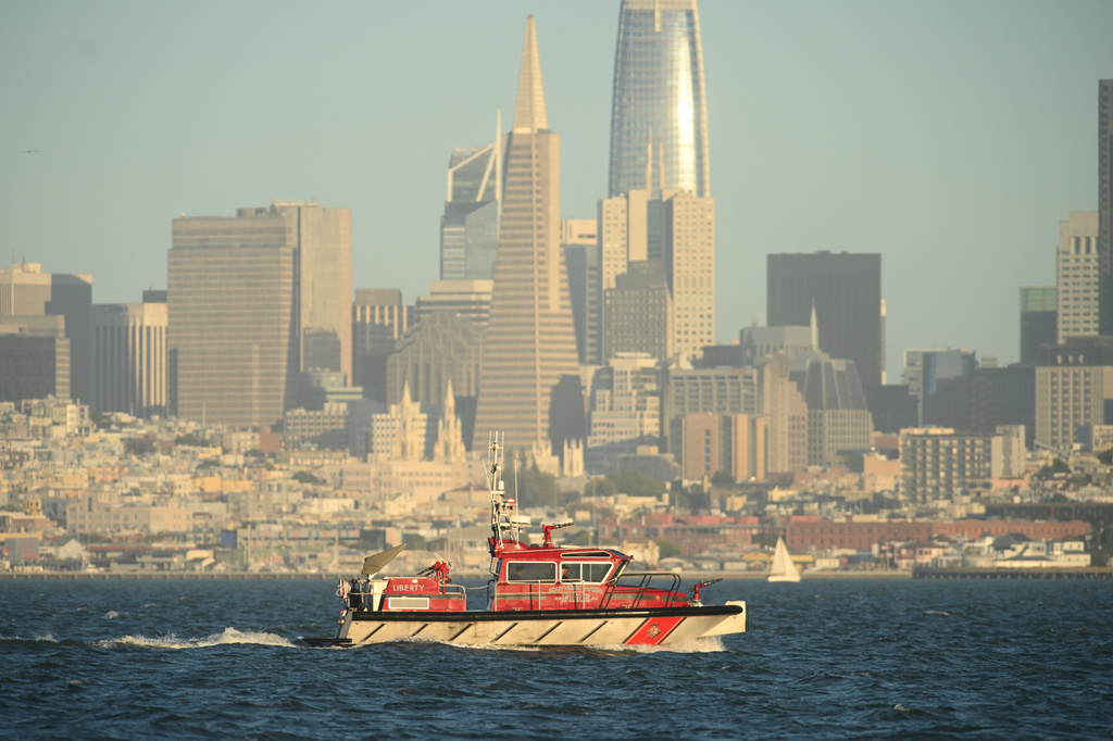 A Southern Marin Fire vessel passes the San Francisco city skyline while searching for missing victims after a boat accident near Alcatraz Island off San Francisco, Tuesday, July 14, 2026. (AP Photo/Noah Berger)