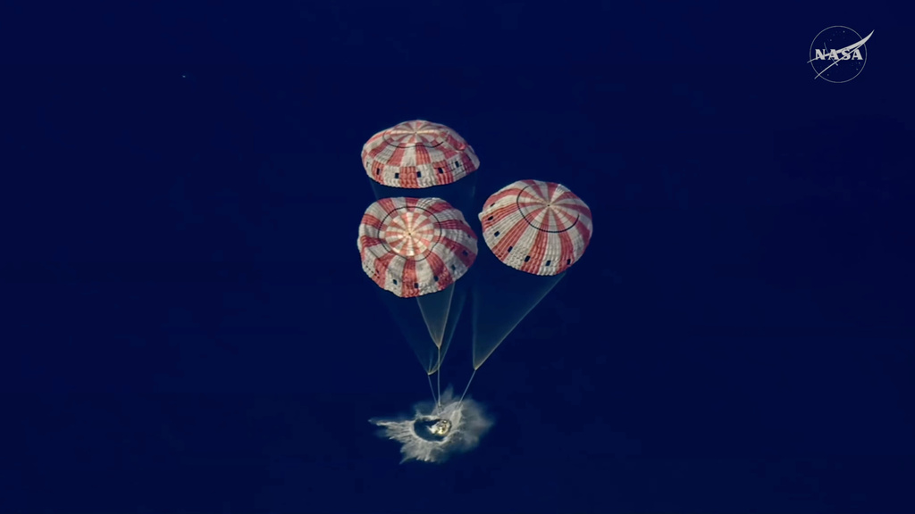 In this image from video provided by NASA, the Artemis II Orion capsule splashes down in the Pacific Ocean, on Friday, April 10, 2026. (NASA via AP)