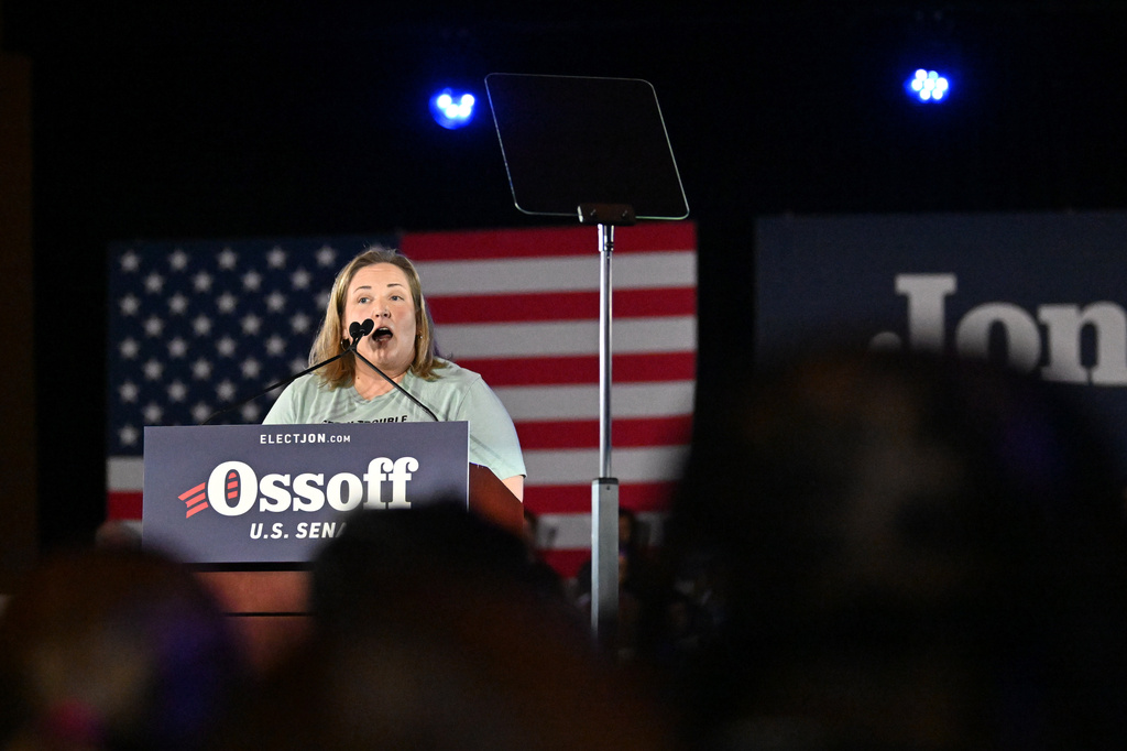 Teresa Acosta, Affordable Care Act (ACA) recipient, speaks before U.S. Sen. Jon Ossoff takes on the stage during "Rally for Our Republic with U.S. Senator Jon Ossoff" at the Georgia International Convention Center, Saturday, Feb. 7, 2026, in College Park, Ga. (Hyosub Shin/Atlanta Journal-Constitution via AP)