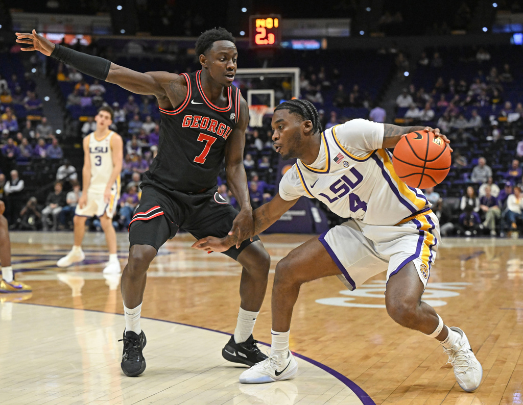 LSU guard Rashad King (4) drives the ball around Georgia guard Justin Bailey (7) during an NCAA college basketball game, Saturday, Feb. 7, 2026, in Baton Rouge, La. (Hilary Scheinuk/The Advocate via AP)