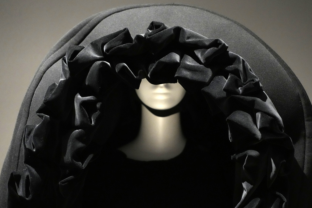A dress by Rei Kawakubo is displayed during a press preview for the exhibit "Dress, Dreams and Desire: Fashion and Psychoanalysis" on Tuesday, Sept. 9, 2025, at The Museum at FIT in New York. (Photo by Charles Sykes/Invision/AP)