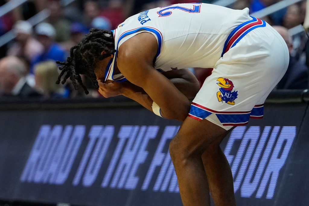 Kansas guard Darryn Peterson reacts after an injury while playing California Baptist during the second half in the first round of the NCAA college basketball tournament Friday, March 20, 2026, in San Diego. (AP Photo/Mark J. Terrill)