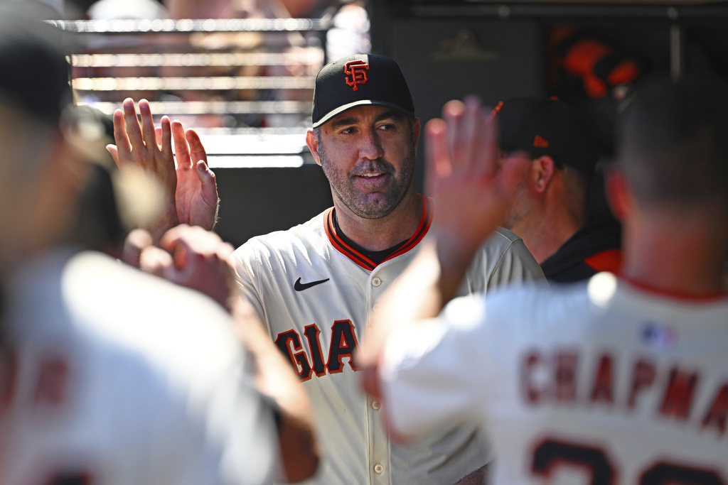 San Francisco Giants pitcher Justin Verlander (35) is congratulated by his teammates in the dugout during the fifth inning of a baseball game against the Baltimore Orioles at Oracle Park in San Francisco on Sunday, Aug. 31, 2025. (Jose Carlos Fajardo/Bay Area News Group via AP)