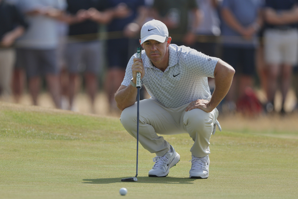 Rory McIlroy of Northern Ireland looks at the lie of his putt on the 4th green during the second day of the British Open Golf championships at Royal Birkdale golf club, in Southport, England, Friday, July 17, 2026. (AP Photo/Peter Morrison)