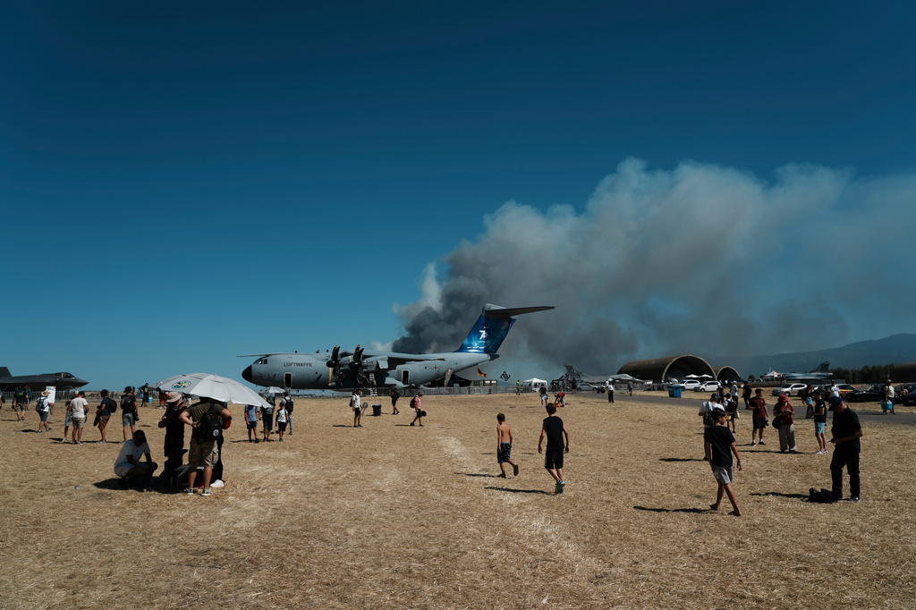 Smoke rises after a Hellenic Air Force F-4 Phantom fighter jet crashed, during the Athens Flying Week airshow at Tanagra Air Force Base, north of Athens, Greece, Saturday, Sept. 5, 2026. (AP Photo/Kallista Allaway)