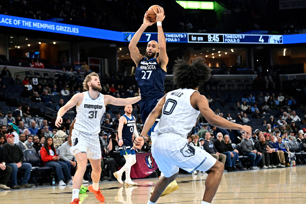 Minnesota Timberwolves center Rudy Gobert (27) handles the ball against Memphis Grizzlies center Jock Landale (31) in the first half of an NBA basketball game Monday, Feb. 2, 2026, in Memphis, Tenn. (AP Photo/Brandon Dill)