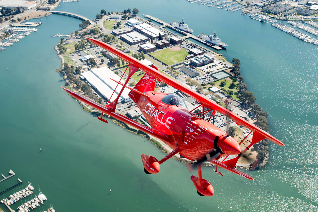 FILE - Team Oracle aerobatics pilot Sean D. Tucker flies over Coast Guard Island during a photo flight on Thursday, Oct. 5, 2017, in Oakland, Calif. (AP Photo/Noah Berger, File)