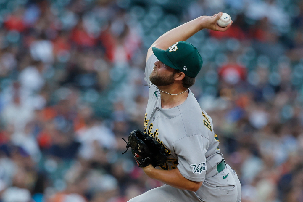 Athletics' Mason Barnett (63) pitching against the Detroit Tigers during the sixth inning of a baseball game Wednesday, July 8, 2026, in Detroit. (AP Photo/Duane Burleson)