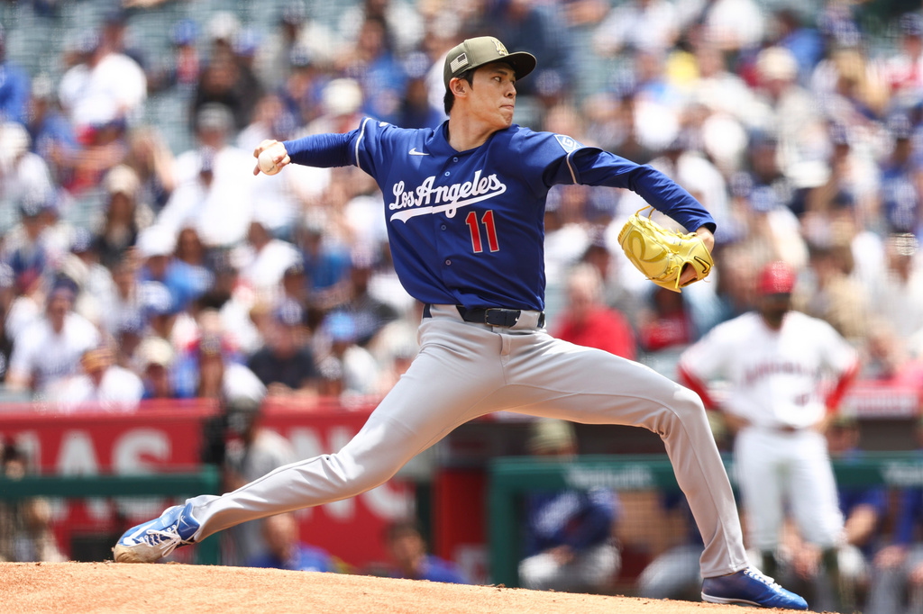 Los Angeles Dodgers pitcher Roki Sasaki (11) throws to a Los Angeles Angels batter during the first inning of a baseball game, Sunday, May 17, 2026, in Anaheim, Calif. (AP Photo/Jessie Alcheh)