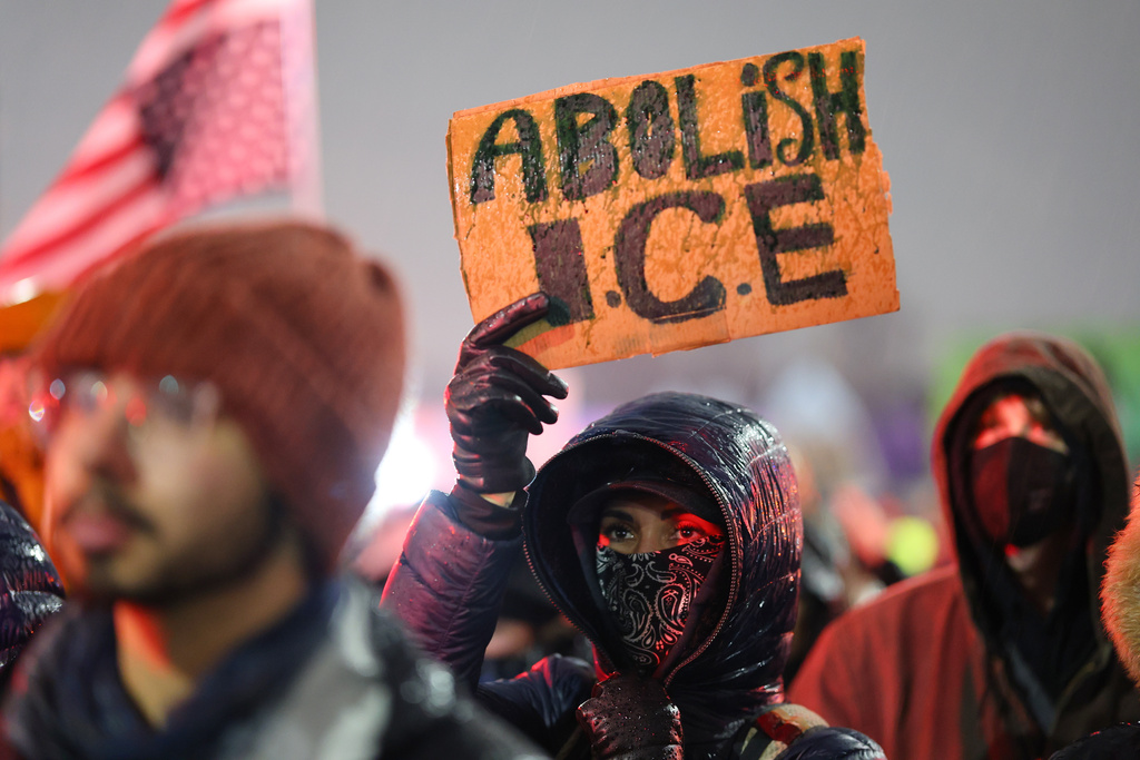 Protesters gather during a rally for Renee Good, Thursday, Jan. 8, 2026, in Minneapolis, after she was fatally shot by an ICE officer the day before. (AP Photo/Adam Bettcher)