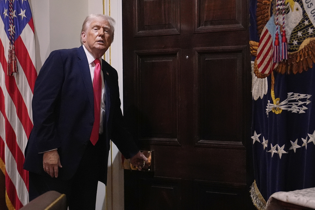 President Donald Trump walks out of the Cabinet Room following a Cabinet meeting at the White House, Tuesday, Dec. 2, 2025, in Washington. (AP Photo/Julia Demaree Nikhinson)