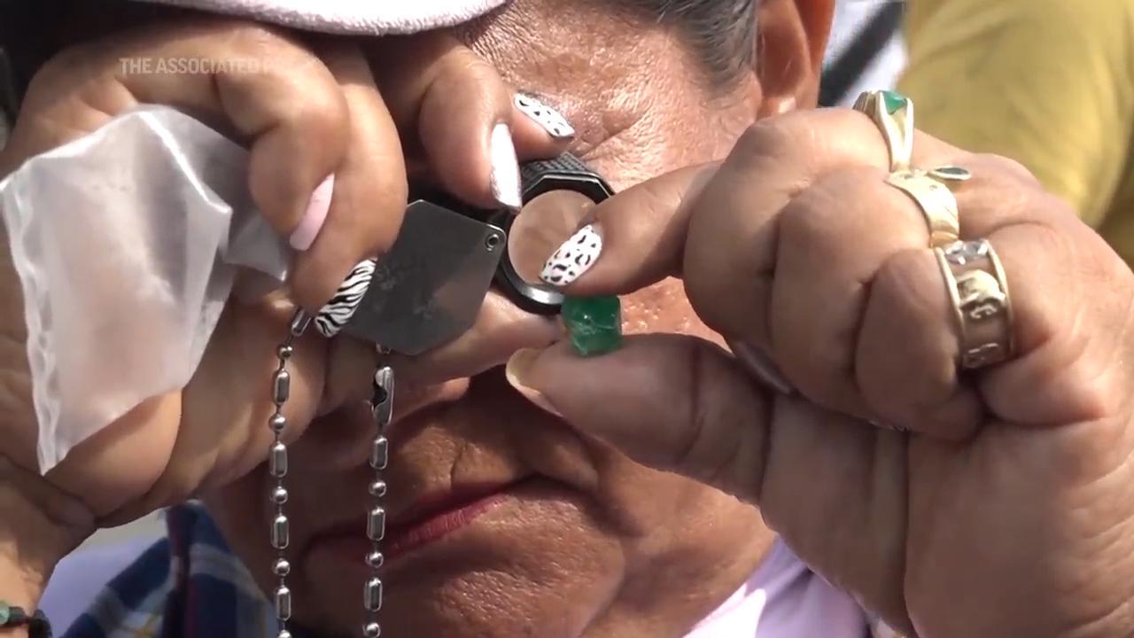 In tunnels dug hundreds of feet into the earth, hammers pound in search of something shiny and green, where oxygen is scarce and the heat so stifling it would make anyone sick. The hands holding these tools are those of a group of 200 Colombian women who search for emeralds in what is traditionally a man's world. (March 7) (AP Video/Marko Alvarez)