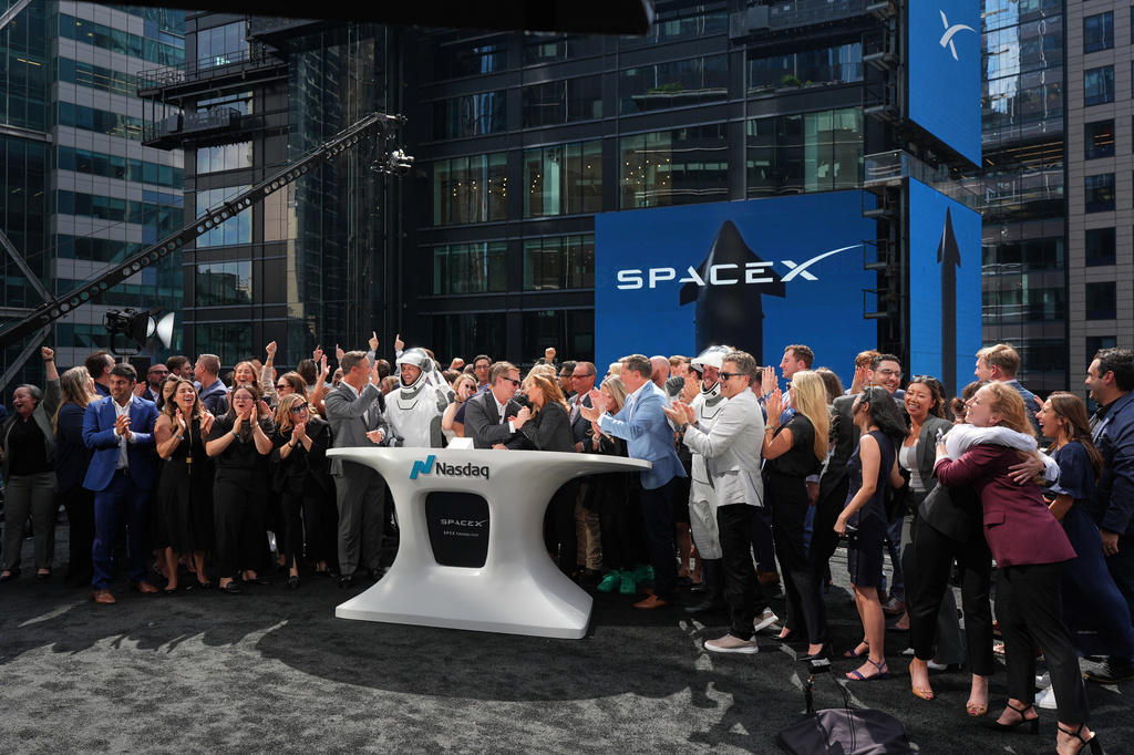 SpaceX employees celebrate during a closing bell ceremony for the IPO of SpaceX at the Nasdaq MarketSite in New York, Friday, June 12, 2026, in New York. (AP Photo/Frank Franklin II)