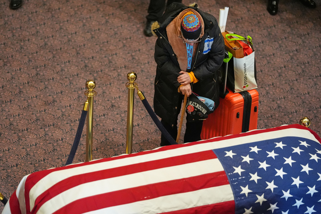 People pay their respects to the Rev. Jesse Jackson inside the South Carolina Statehouse as he lies in state Monday, March 2, 2026, in Columbia, S.C. (AP Photo/Matt Kelley, Pool)