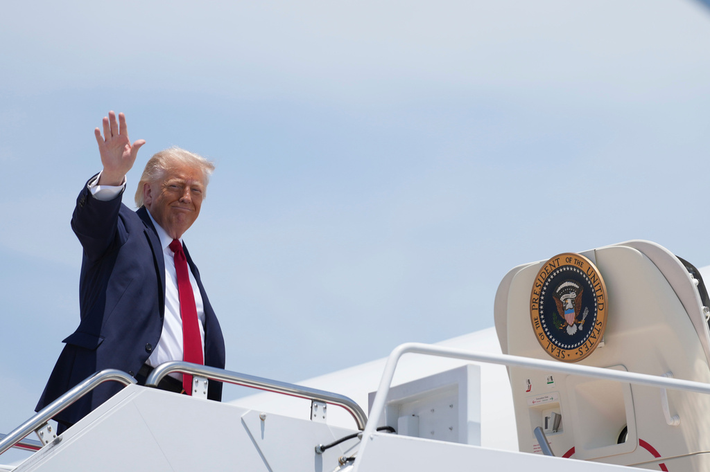 President Donald Trump waves as he boards Air Force One, Friday, June 5, 2026, at Joint Base Andrews, Md. (AP Photo/Mark Schiefelbein)