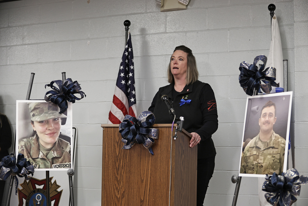 Volunteer Jamie Ackerly speaks during a vigil in honor of National Guard member Specialist Sarah Beckstrom, one of two National Guard members who were shot in Washington on Wednesday, in Webster Springs, W.Va., Friday, Nov. 28, 2025. (AP Photo/Kathleen Batten)
