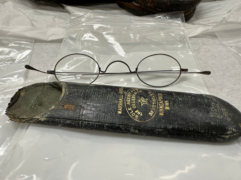The eyeglasses and case belonging to Mark Kellogg, a reporter killed during the Battle of the Little Bighorn in 1876, are displayed Wednesday, June 24, 2026, at the North Dakota Heritage Center and State Museum in Bismarck, N.D. (AP Photo/Jack Dura)