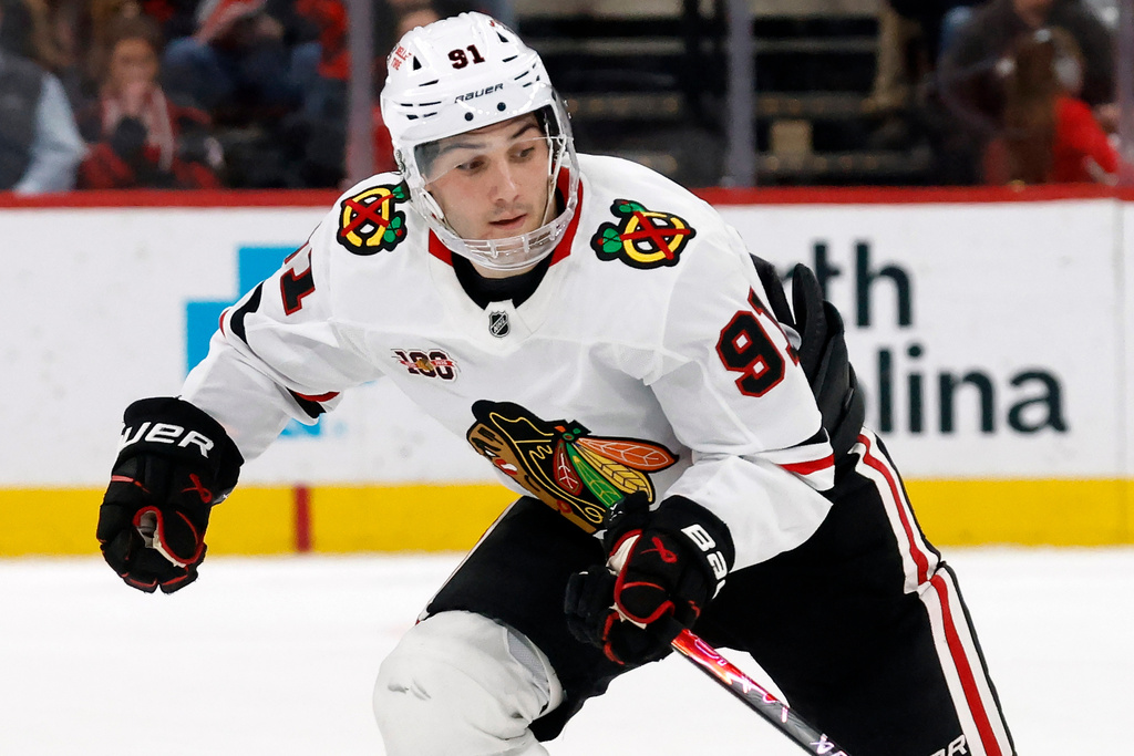 FILE - Chicago Blackhawks' Frank Nazar (91) takes a shot during a shootout of an NHL hockey game against the Carolina Hurricanes in Raleigh, N.C., Thursday, Jan. 22, 2026. (AP Photo/Karl DeBlaker, File)