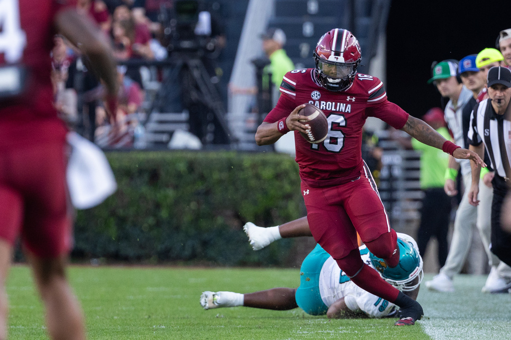 South Carolina quarterback Lanorris Sellers (16) tiptoes for a first down against the Coastal Carolina during the first half of an NCAA college football game, Saturday, Nov. 22, 2025, in Columbia, S.C. (AP Photo/Scott Kinser)