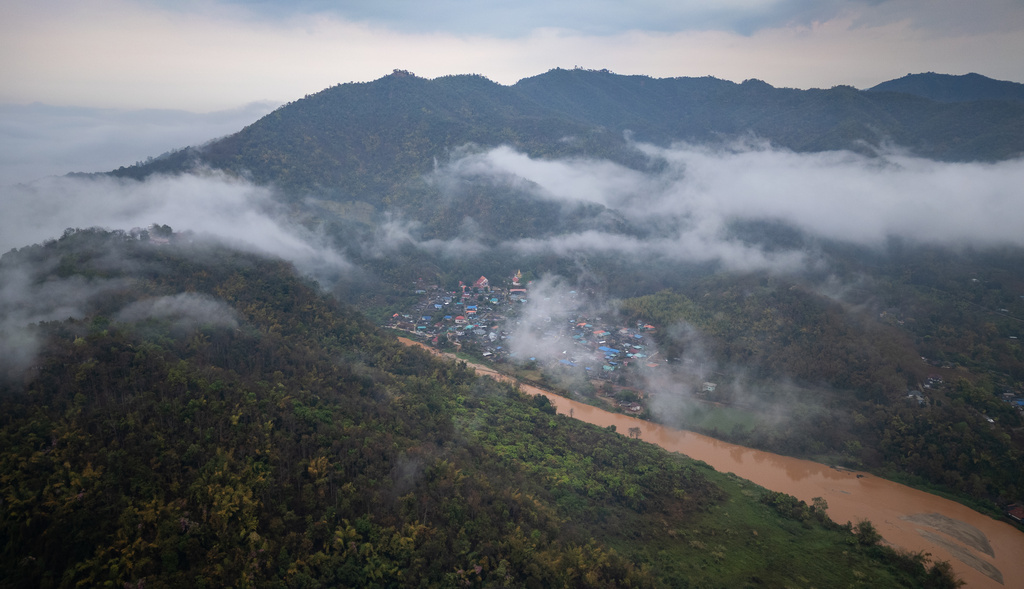Morning mist blankets the Thai village of Tha Ton, where the Kok River enters Thailand from Myanmar, Feb. 20, 2026. (AP Photo/Anton L. Delgado)