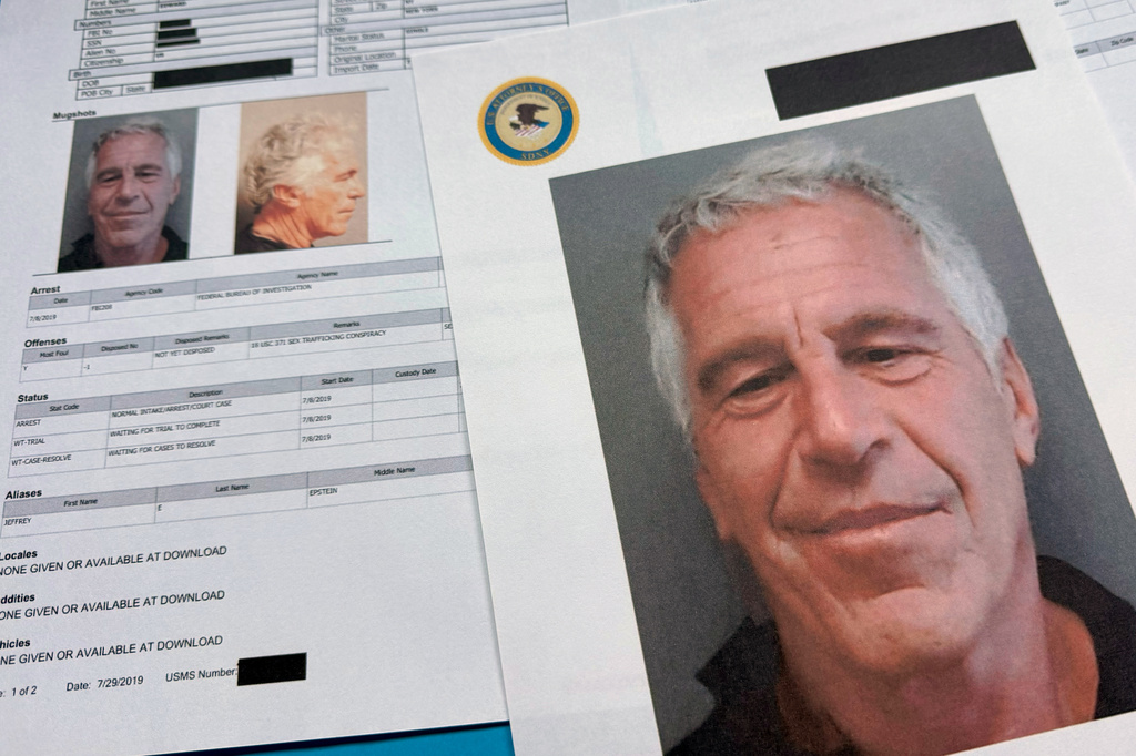 FILE - Documents that were included in the U.S. Department of Justice release of the Jeffrey Epstein files are photographed on Jan. 2, 2026. (AP Photo/Jon Elswick, File)