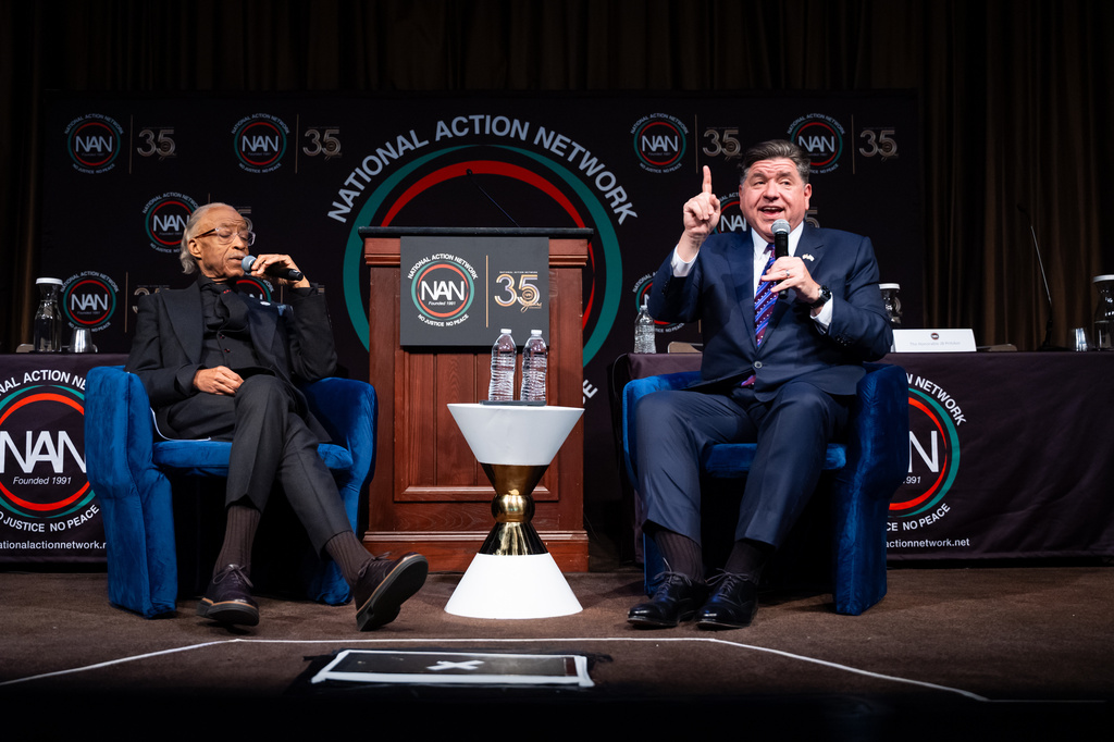 Illinois Gov. J.B. Pritzker speaks at the National Action Network Convention, accompanied by the Rev. Al Sharpton, in New York, Thursday, April 9, 2026. (AP Photo/Angelina Katsanis)