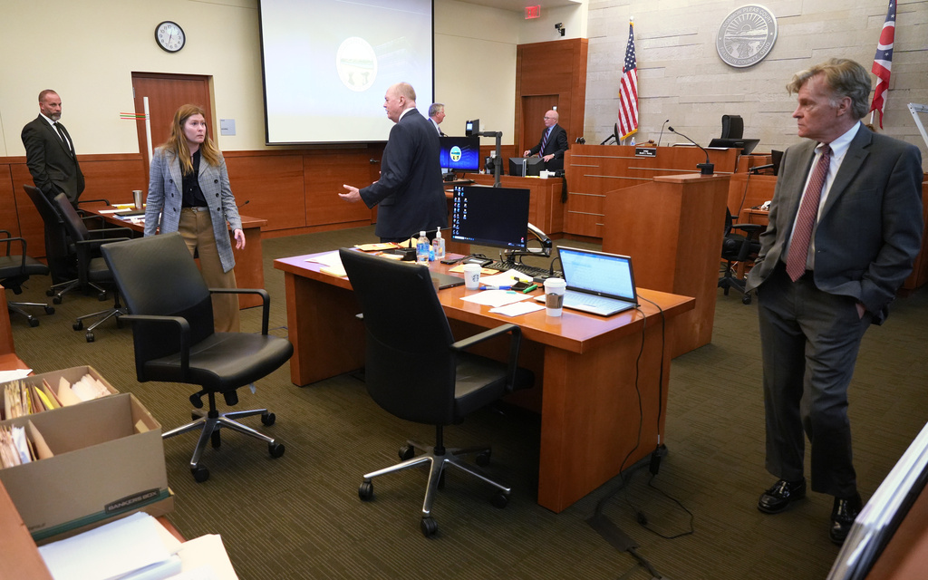 From left, former sheriff's deputy Jason Meade, defense attorney Kaitlyn Stephens, prosecutor Howard Tim Merkle and prosecutor Gary Shroyer stand inside the courtroom at Franklin County Court of Common Pleas on Wednesday, May 6, 2026, in Columbus, Ohio. (Doral Chenoweth/The Columbus Dispatch via AP, Pool)