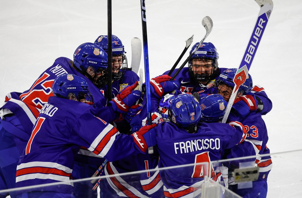Team USA celebrates after defeating Team CHL in overtime CHL-USA Prospects Challenge hockey action in Lethbridge, Alberta, on Wednesday, Nov. 26, 2025. (Jeff McIntosh/The Canadian Press via AP)