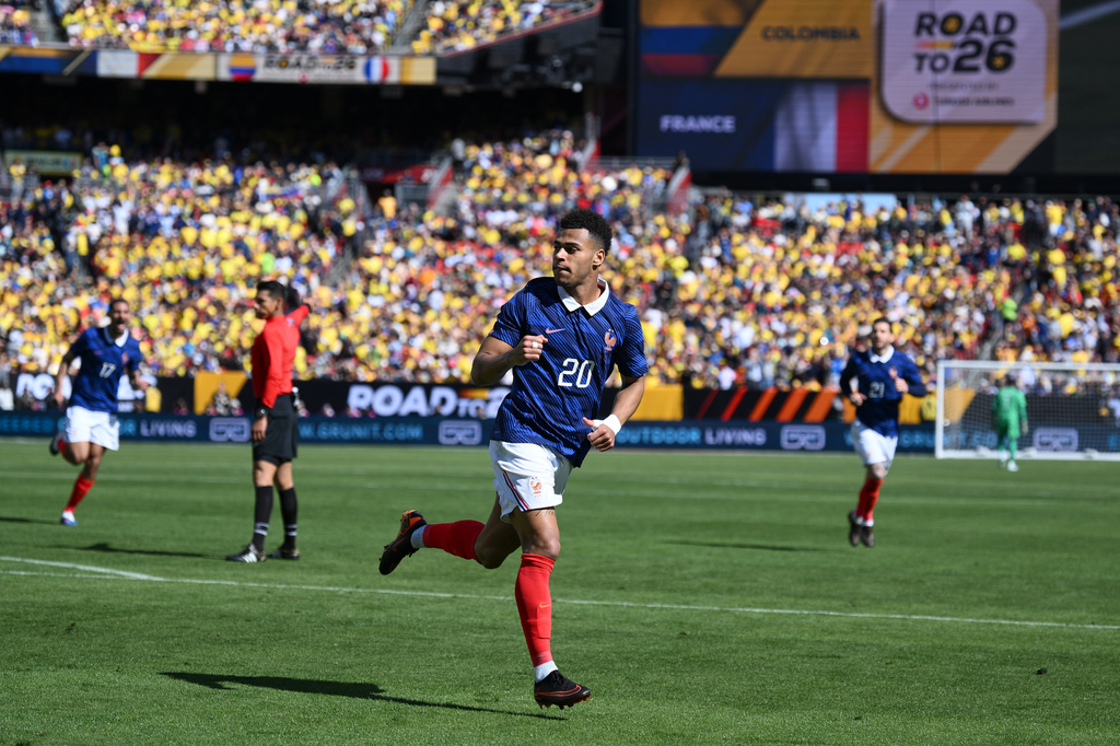 France forward Désiré Doué (20) celebrates after scoring the opening goal during the international friendly soccer match between Colombia and France in Landover, Md., Sunday, March 29, 2026. (AP Photo/Nick Wass)