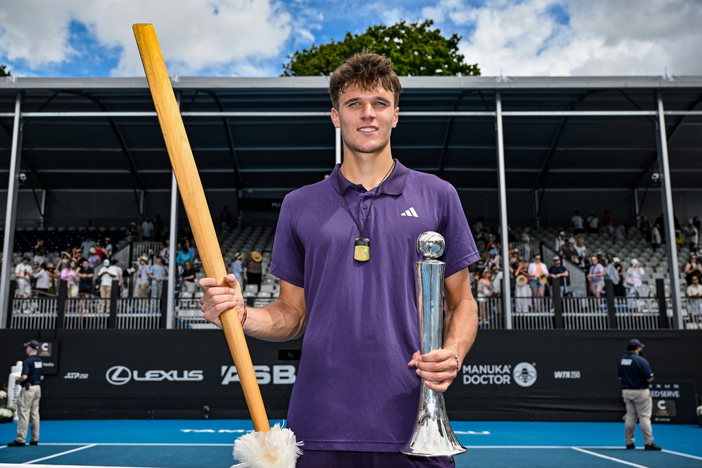 Jakub Mensik of the Czech Republic poses with his trophy after defeating Sebastian Baez of Argentina in the men's singles final of the ASB Classic in Auckland, New Zealand, Saturday, Jan. 17, 2026. (Alan Lee/ Photosport via AP)