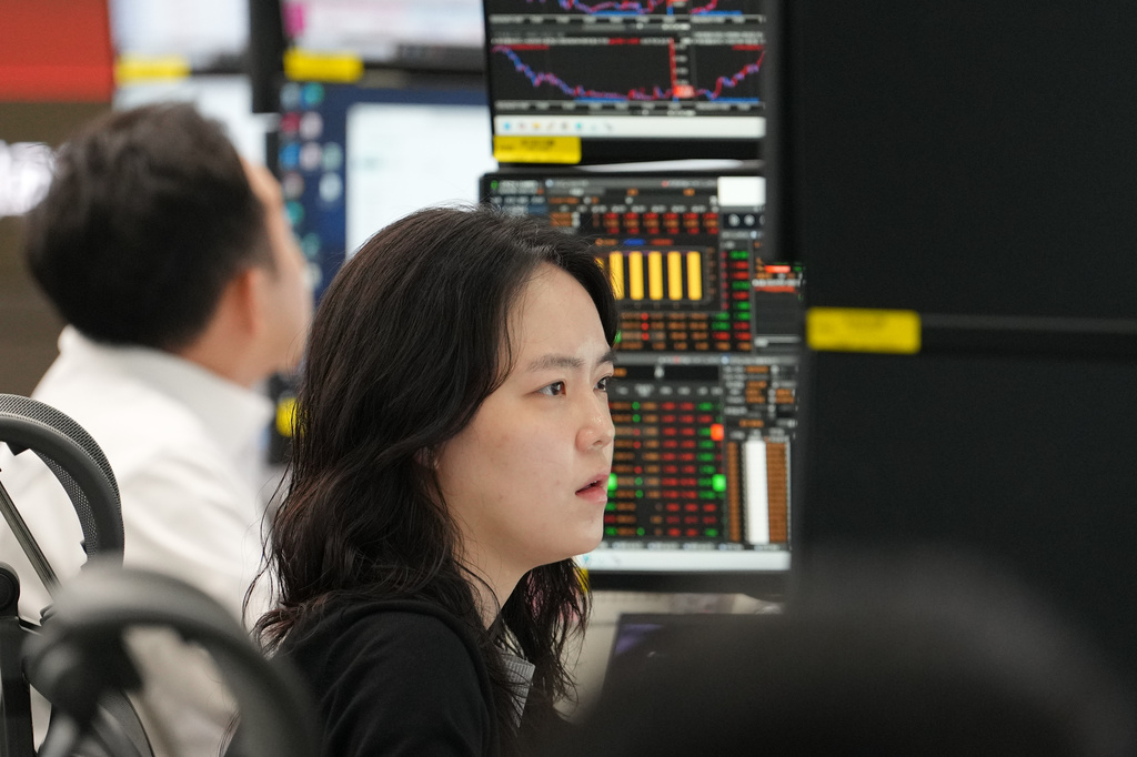 A dealer watches computer monitors at a dealing room of Hana Bank in Seoul, South Korea, Thursday, June 4, 2026. (AP Photo/Lee Jin-man)